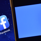 The Facebook app logo is displayed on an iPad next to a picture of the Facebook logo on an iPhone on August 3, 2016 in London, England.